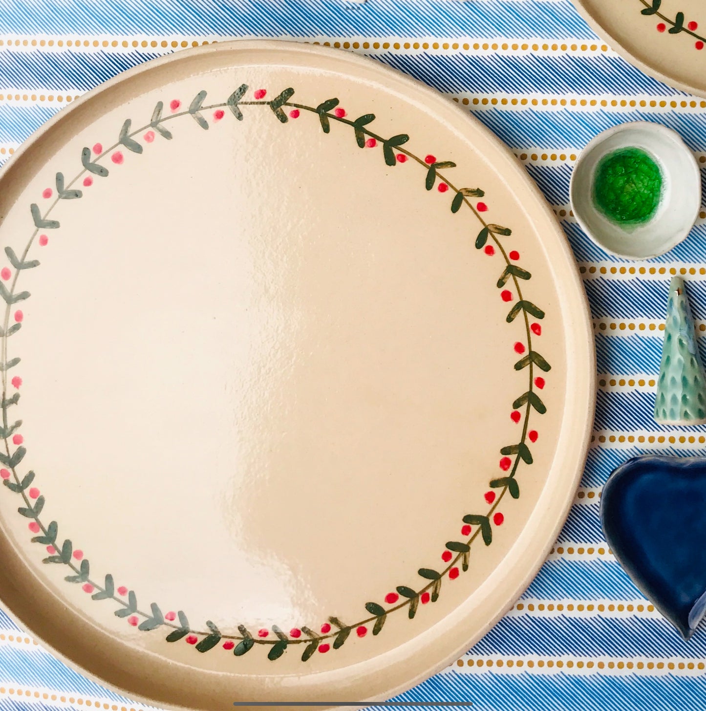 Festive garland round ceramic plates and platters