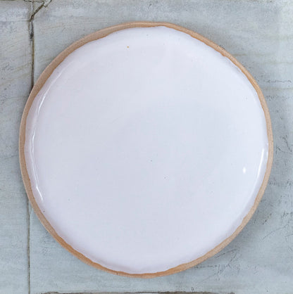 White glazed hand shaped ceramic plate with raw clay toasted rim edge