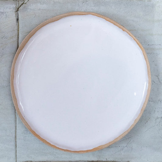 White glazed hand shaped ceramic plate with raw clay toasted rim edge