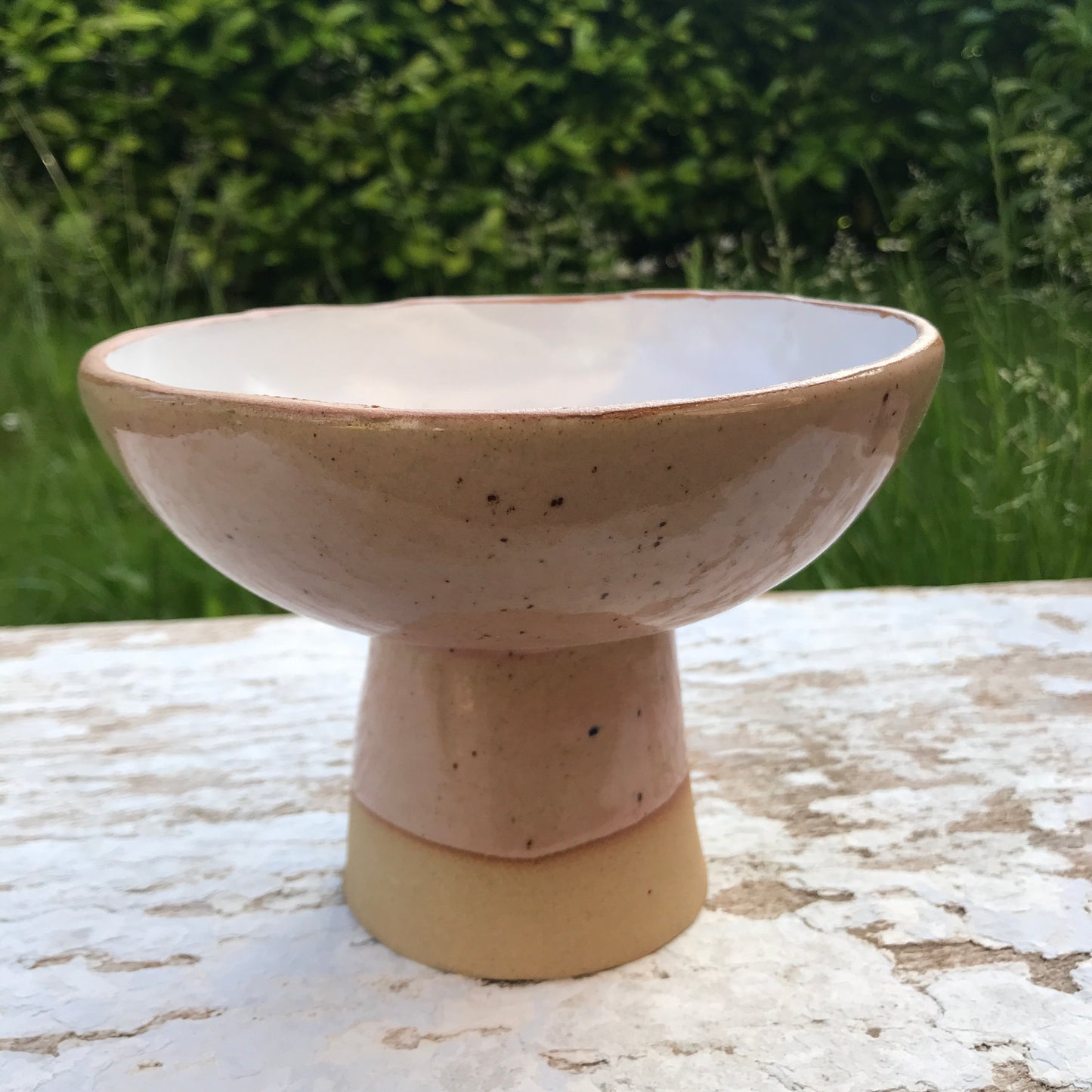 Natural stoneware glazed ceramic raised bowl with speckled glazes