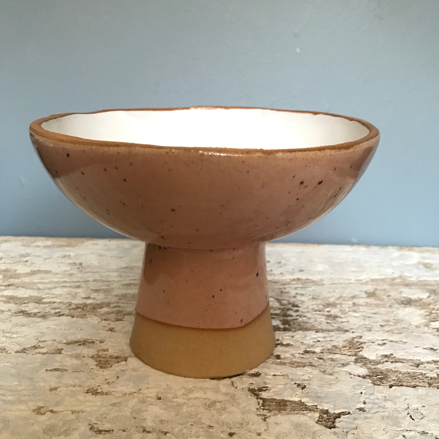 Natural stoneware glazed ceramic raised bowl with speckled glazes