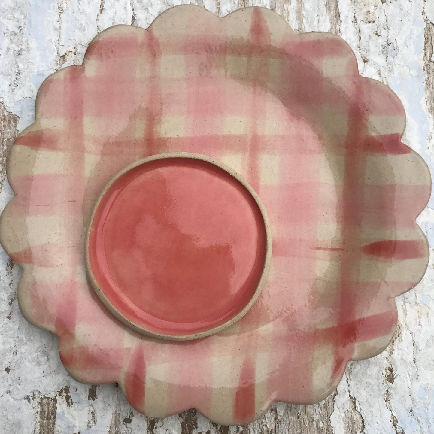 Soft pink and red gingham checked hand shaped ceramic plate with scalloped edge