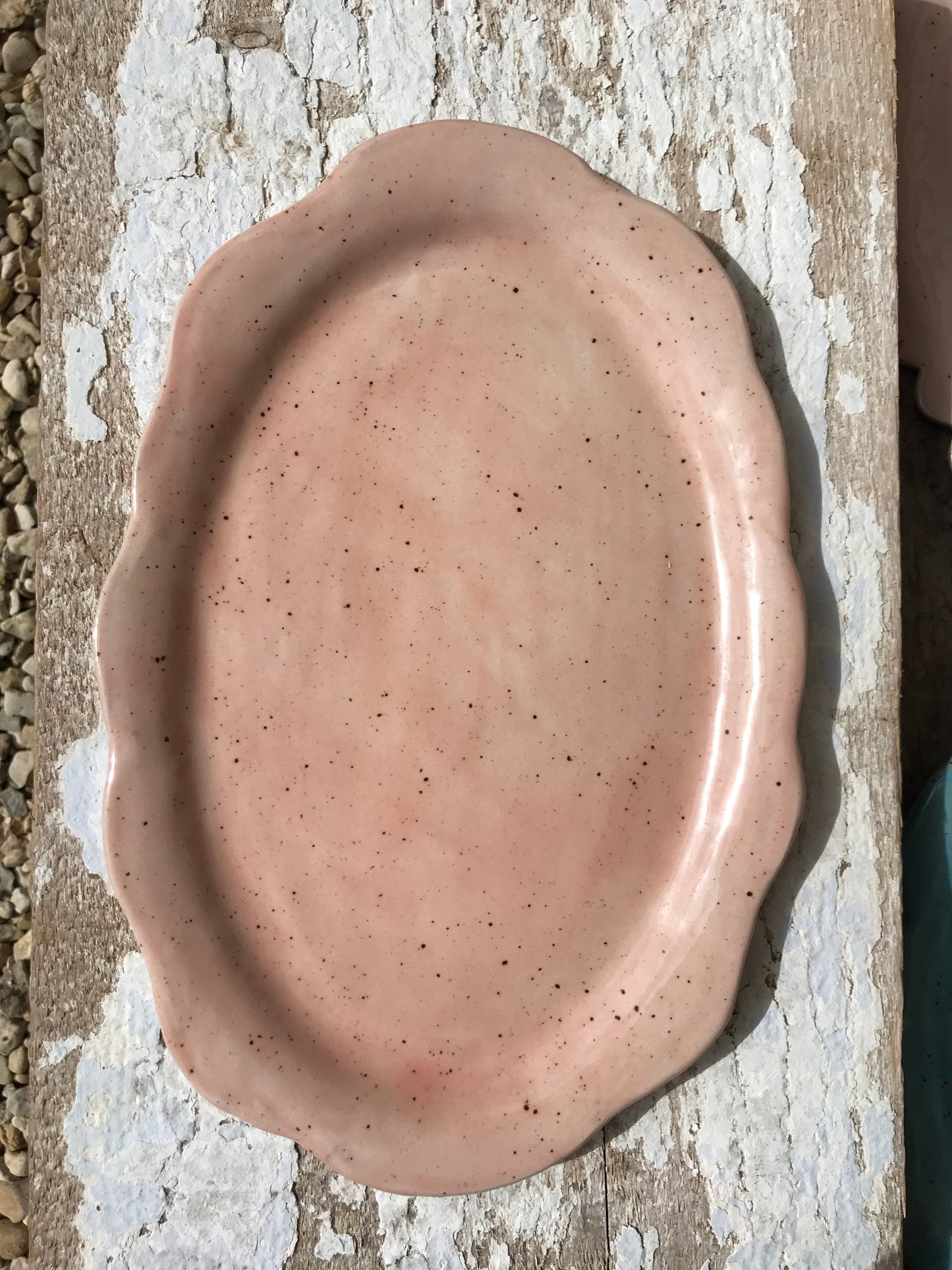 Soft pink hand shaped ceramic platter with scalloped edge