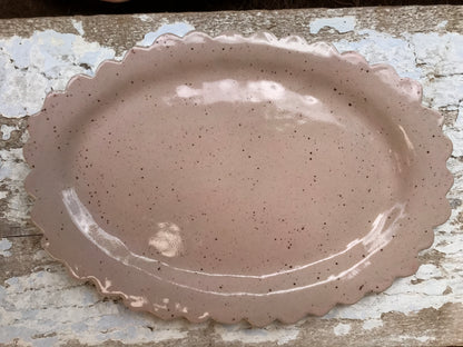 Soft pink hand shaped ceramic platter with scalloped edge