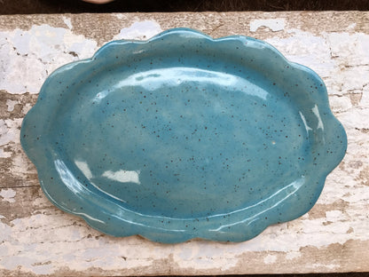 Soft pink hand shaped ceramic platter with scalloped edge