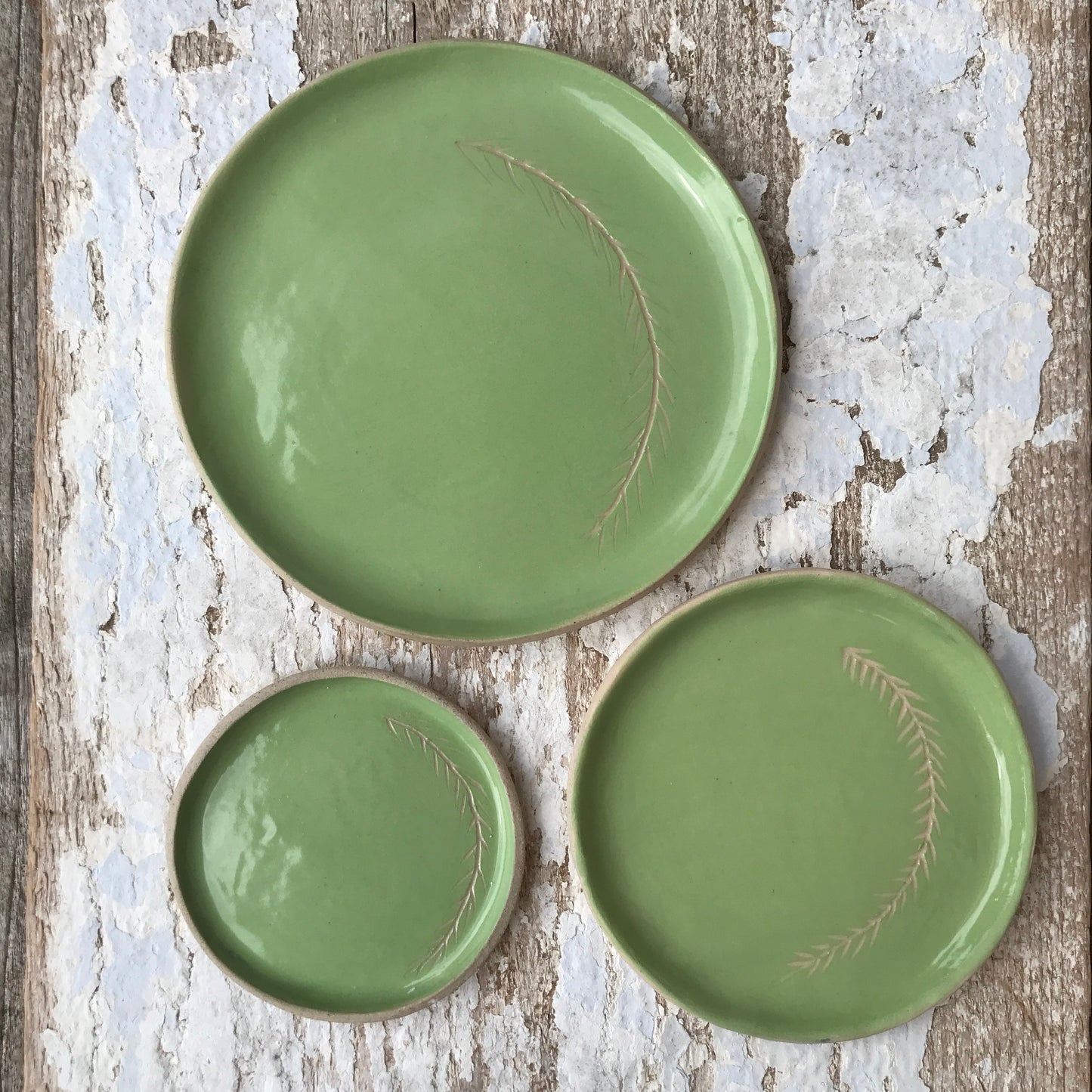 Botanical brights sgraffito ceramic side dish sets in Kingfisher blue, Parakeet green, Goldfinch yellow, Woodpecker teal.