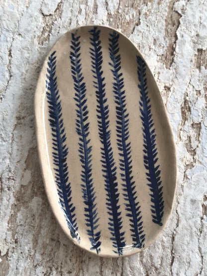 Natural stoneware glazed ceramic oval side plate with hand painted blue leaf garland floral design