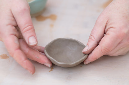 my hands shaping a small ceramic bowl for starlingpots