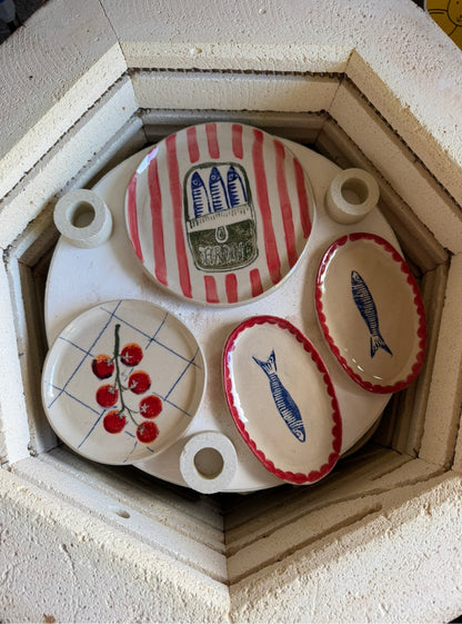 Handmade ceramic sardine oval dishes in pottery kiln