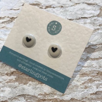 Round shaped, heart painted porcelain hypo-allergenic stud earrings