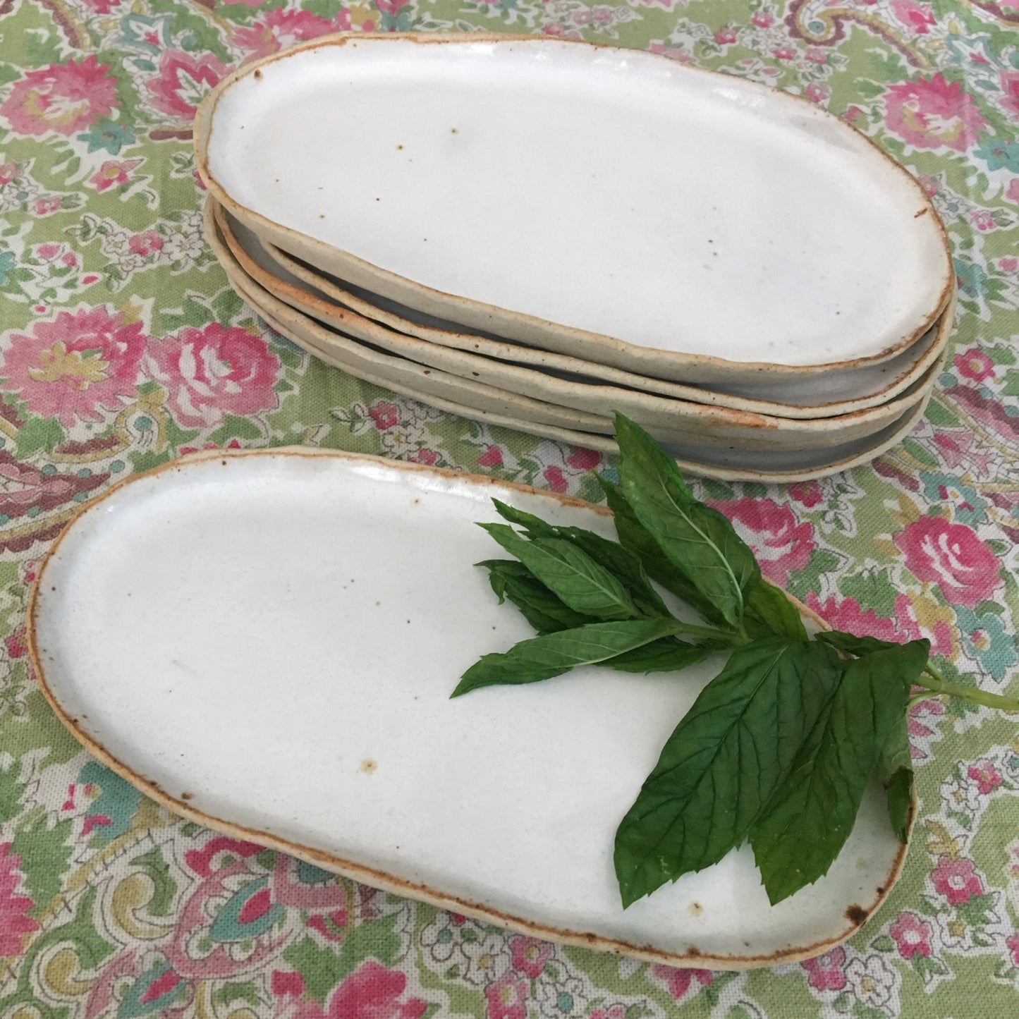 White oval ceramic side dishes