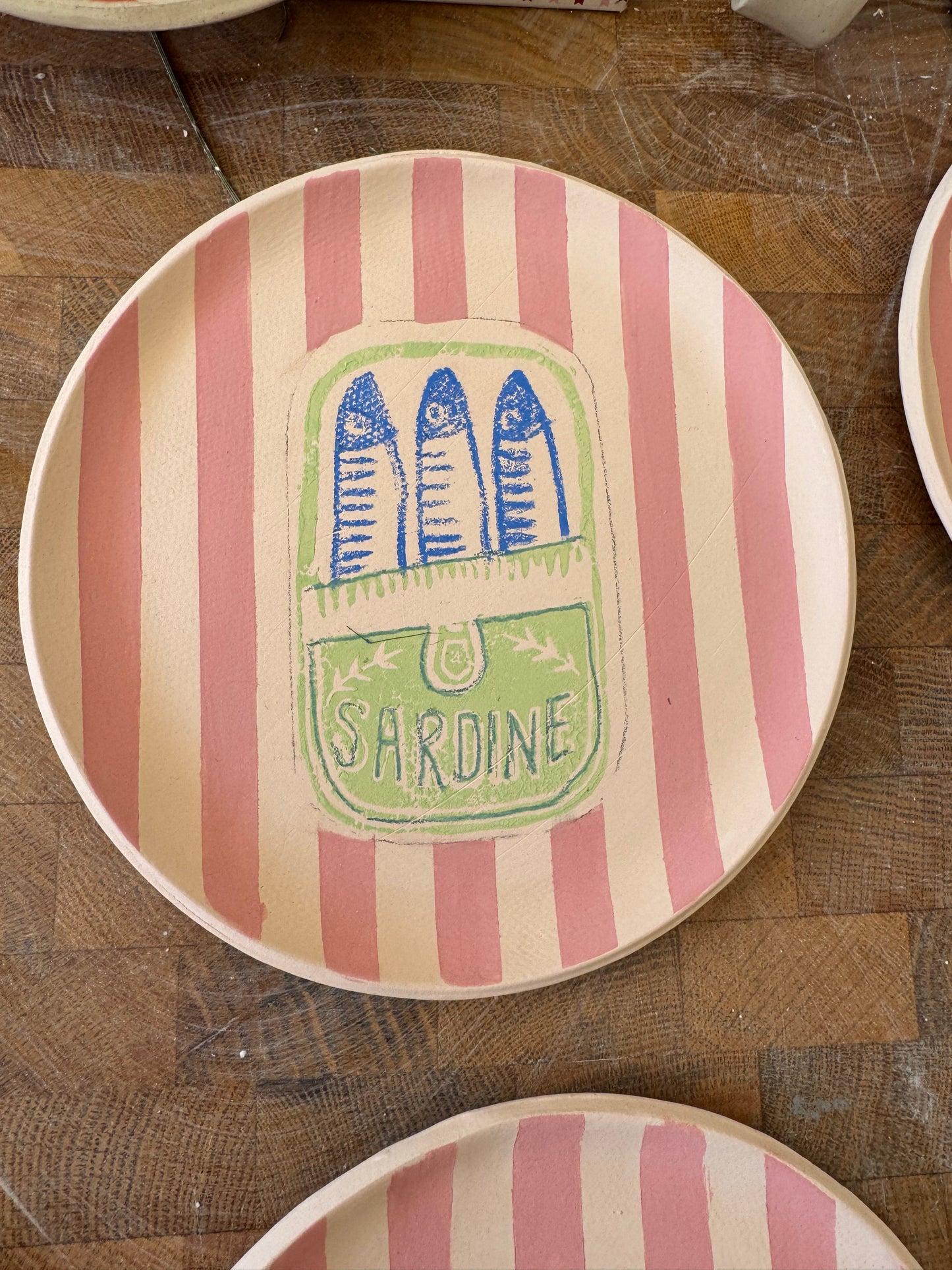 Ceramic sardine tin plate with pink stripes, sage green and blue design